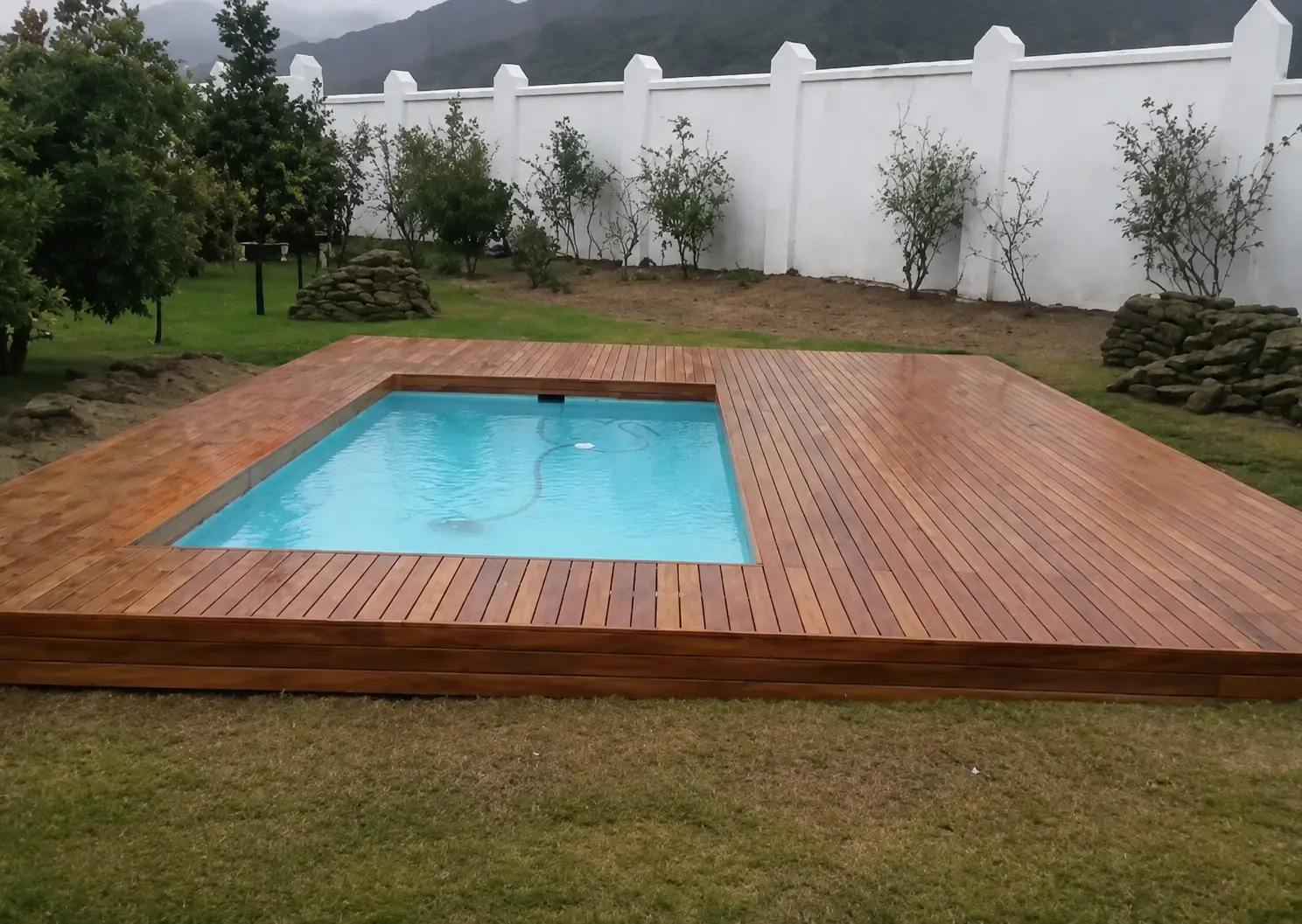 Timber deck around a courtyard swimming pool