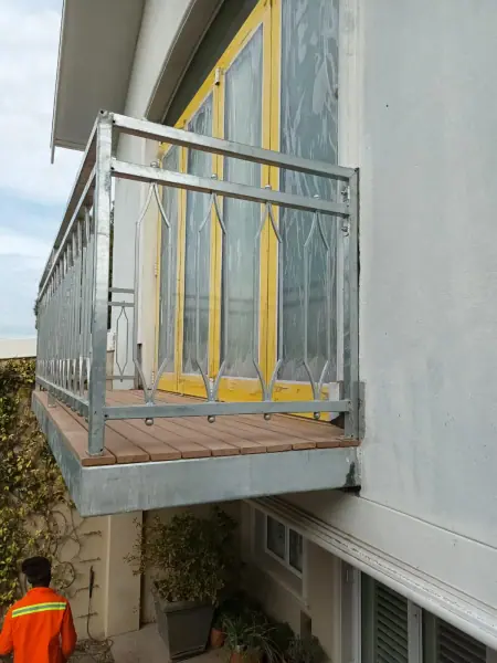 Metal balustrade on a small raised entrance landing