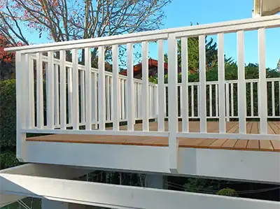 White timber balustrade around an elevated outdoor deck