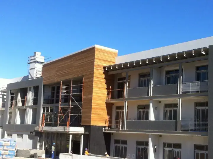 Timber cladding on an upper facade during construction