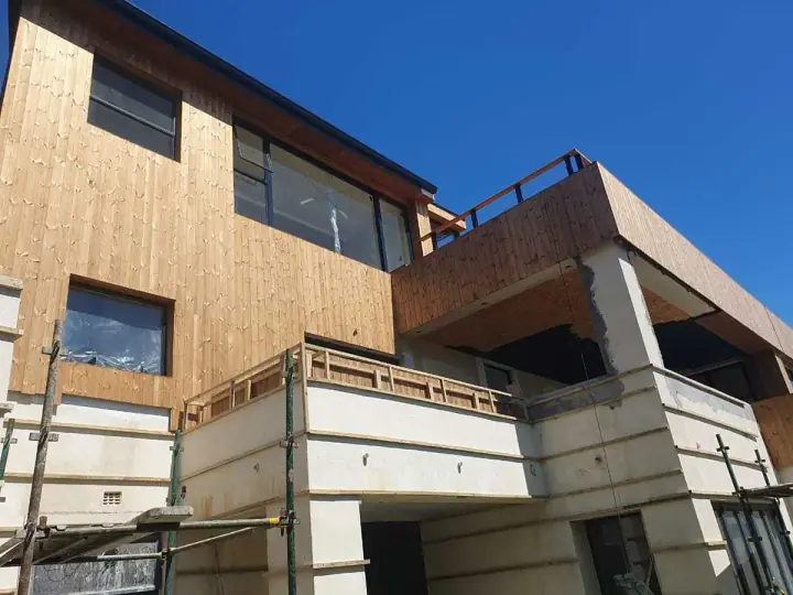 Timber-clad upper level of a contemporary home