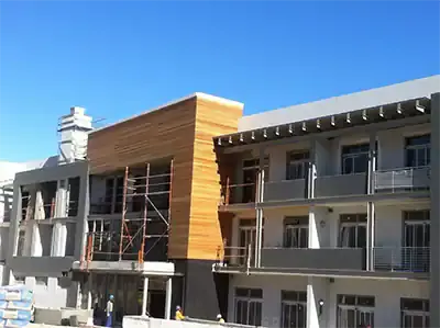 Timber cladding installed on the upper facade of a building
