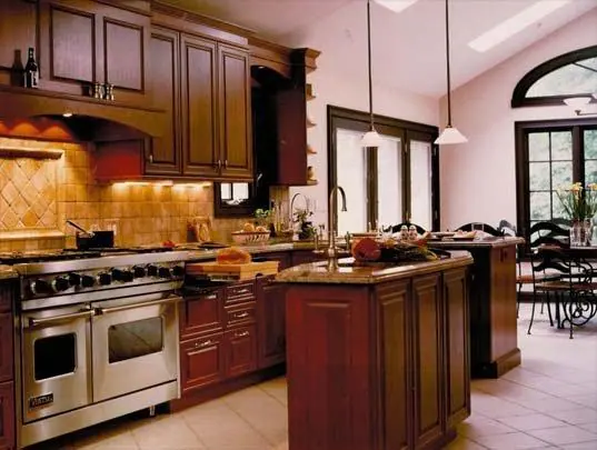 Dark timber kitchen cabinets and a central island