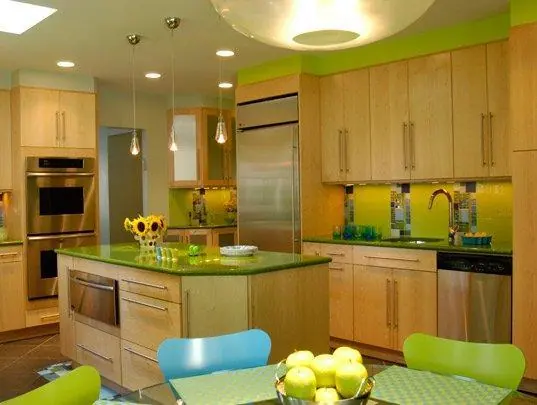 Light timber cabinetry and island in an open kitchen