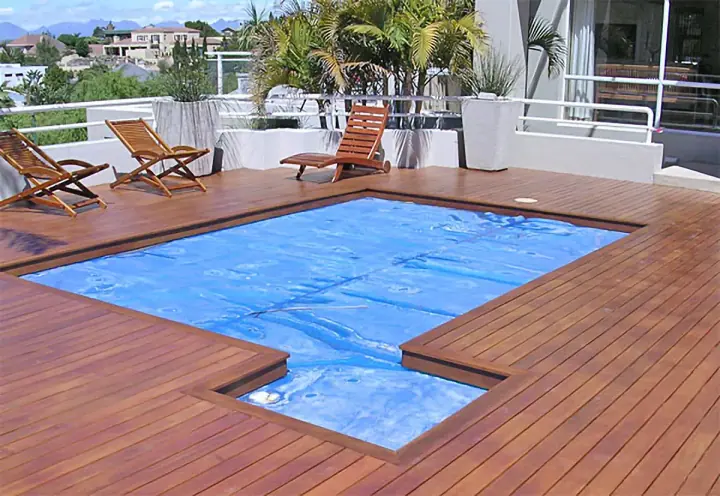 Timber decking around a covered swimming pool