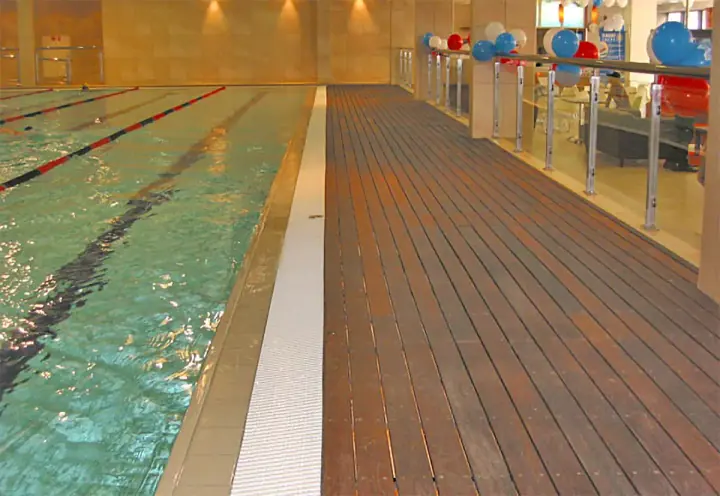 Timber flooring along an indoor swimming pool