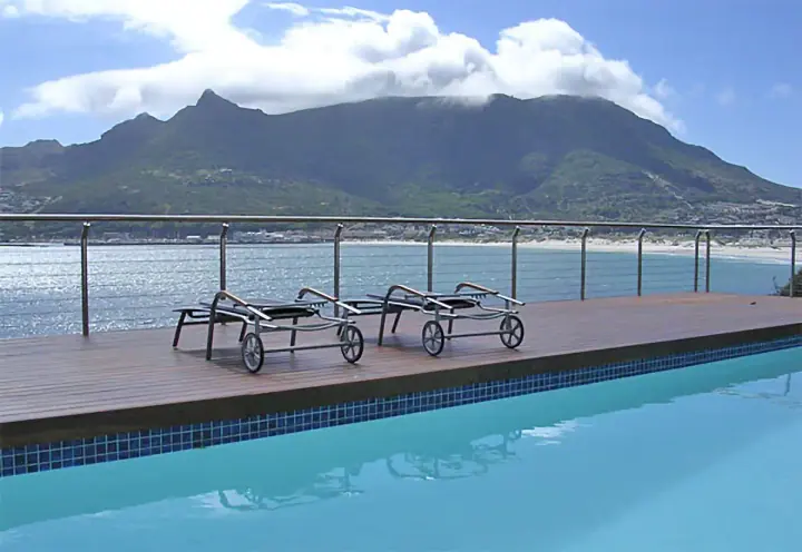 Timber pool deck with mountain views and metal railing