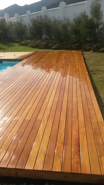 Fresh timber deck extending along the edge of a pool