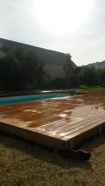 Raised timber deck beside a swimming pool