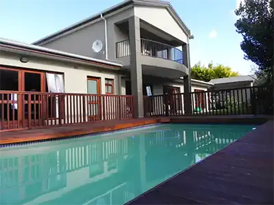 Timber deck and balustrade beside a swimming pool