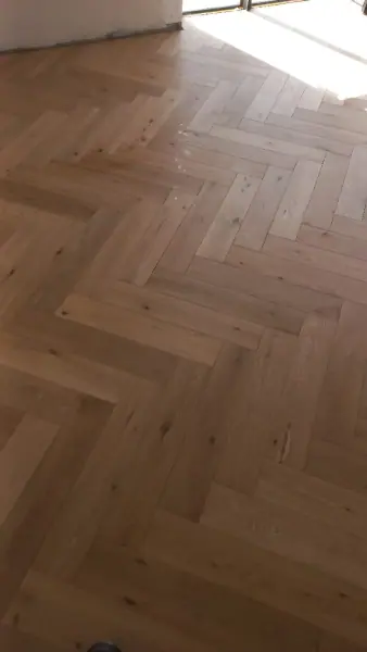 Herringbone timber flooring in a bright interior