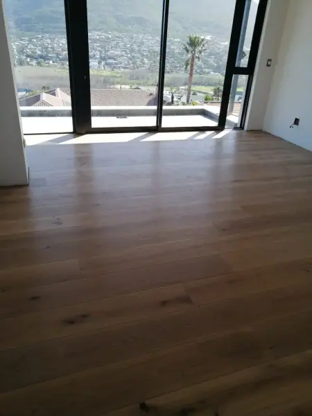 Timber flooring in a room overlooking an outdoor view