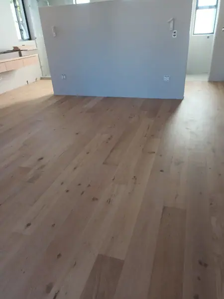 Timber flooring in an unfurnished interior room
