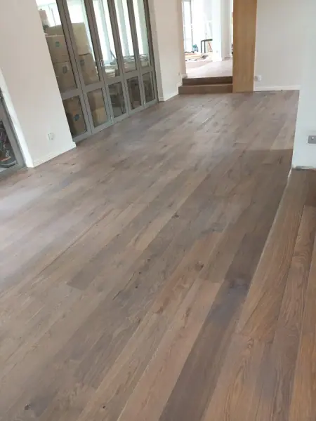 Timber flooring in a bright open-plan interior