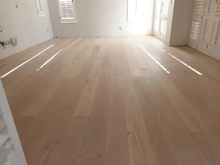 Pale timber flooring in a large bright room