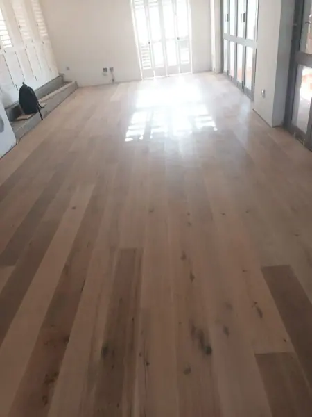 Timber floorboards leading along a hallway
