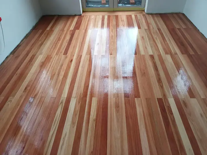 Striped timber floorboards in a bright room