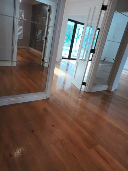 Timber floorboards continuing through a glazed doorway