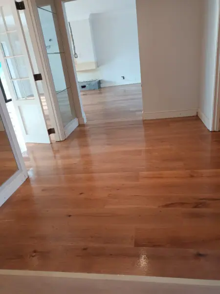 Warm timber floor leading through interior doorways