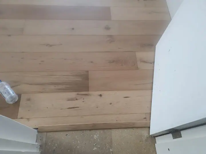 Close view of timber floorboards at a room threshold
