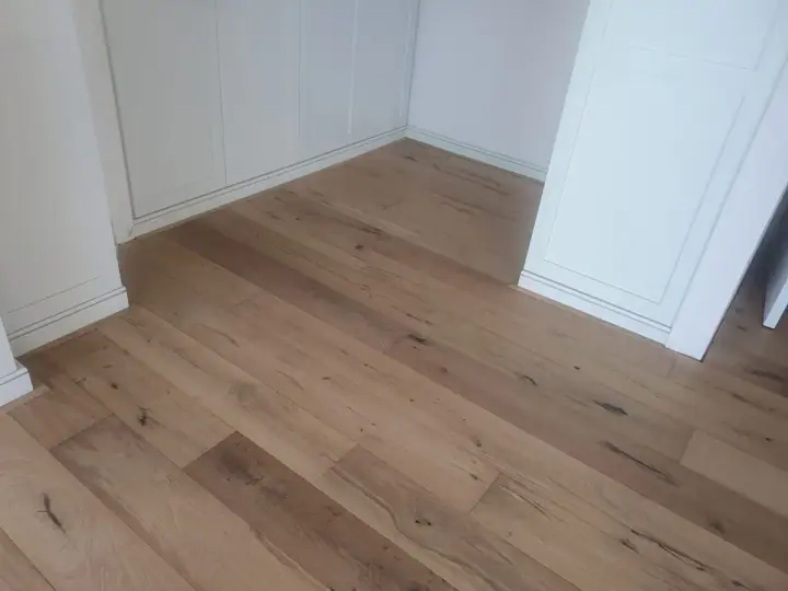 Timber flooring in a small room with white walls