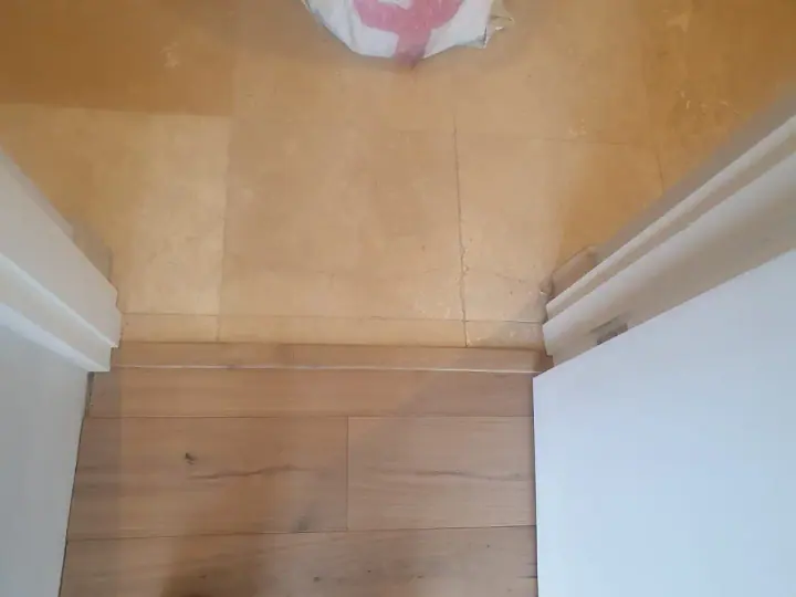 Timber flooring at a doorway and landing