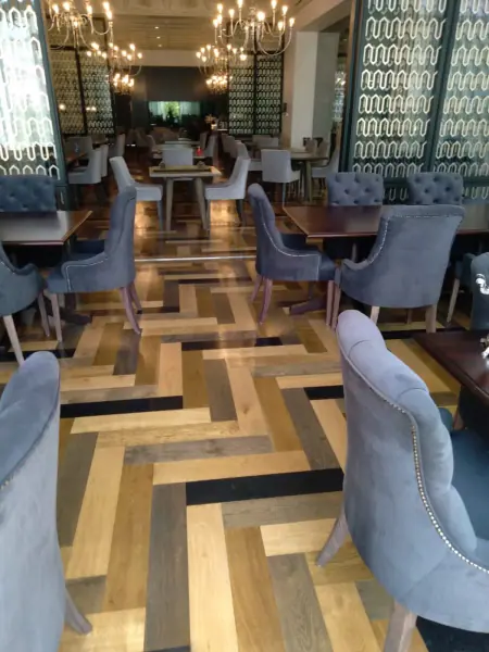 Geometric timber flooring in a restaurant dining area