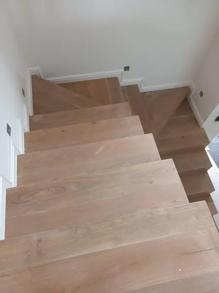 Timber stairs viewed down from the upper floor