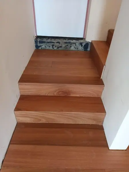 Timber staircase turning at a small landing