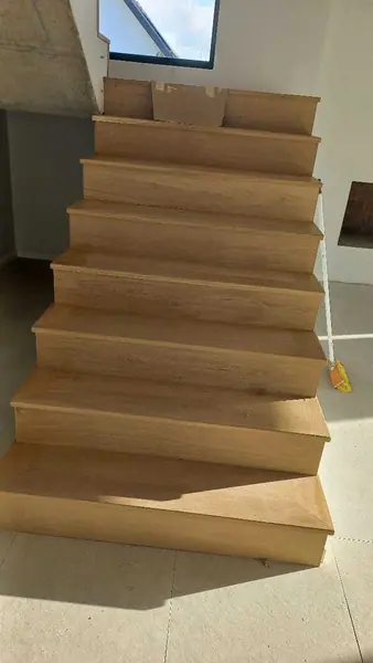 Pale timber staircase viewed from above