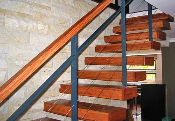 Open timber staircase with a dark metal balustrade