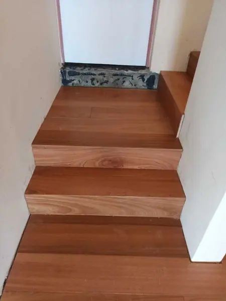 Timber stair treads turning at a small landing