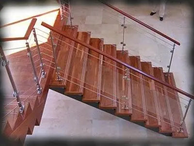 Timber staircase with glass panels and a handrail